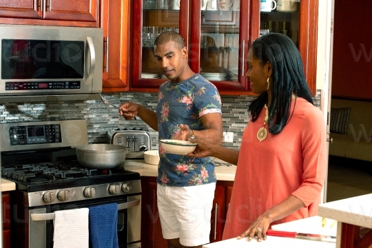 Couple cooking in Kitchen