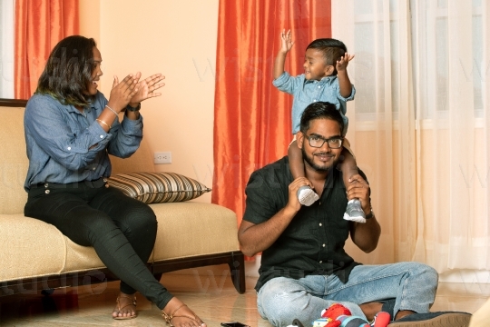 Family in on Sofa in Living Room XI