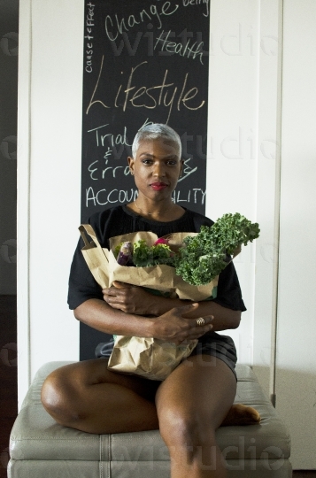 Healthy Woman sitting with Vegetables