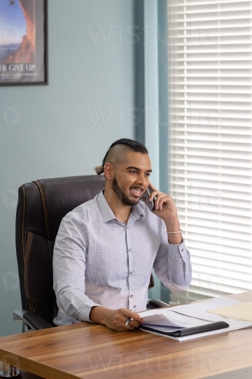 Male employee on phone