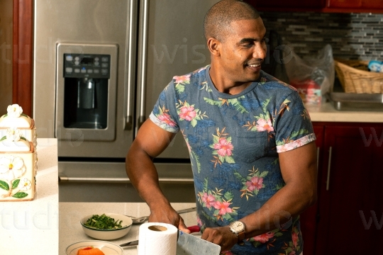 Man in prepping in Kitchen