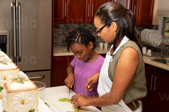 Mother and Daughter prepping in the Kitchen