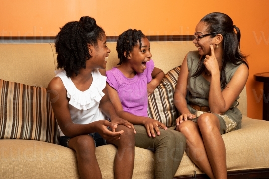 Mother with Daughters in Living Room 