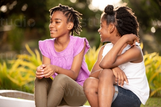 Sisters Chatting Outside II