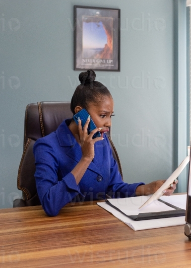 Woman in office on mobile