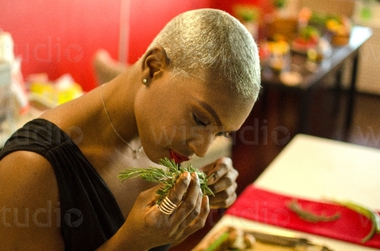 Woman Smelling Seasoning