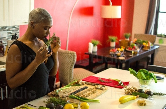 Woman Smelling Vegetables