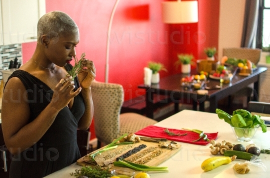Woman Smelling Vegetables