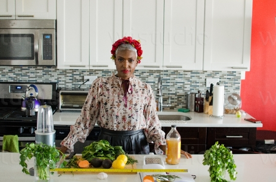 Woman wit Vegetables in Kitchen